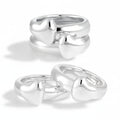 Two silver heart-shaped rings on a white background