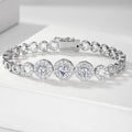 Silver bracelet with diamond-like stones on a white surface