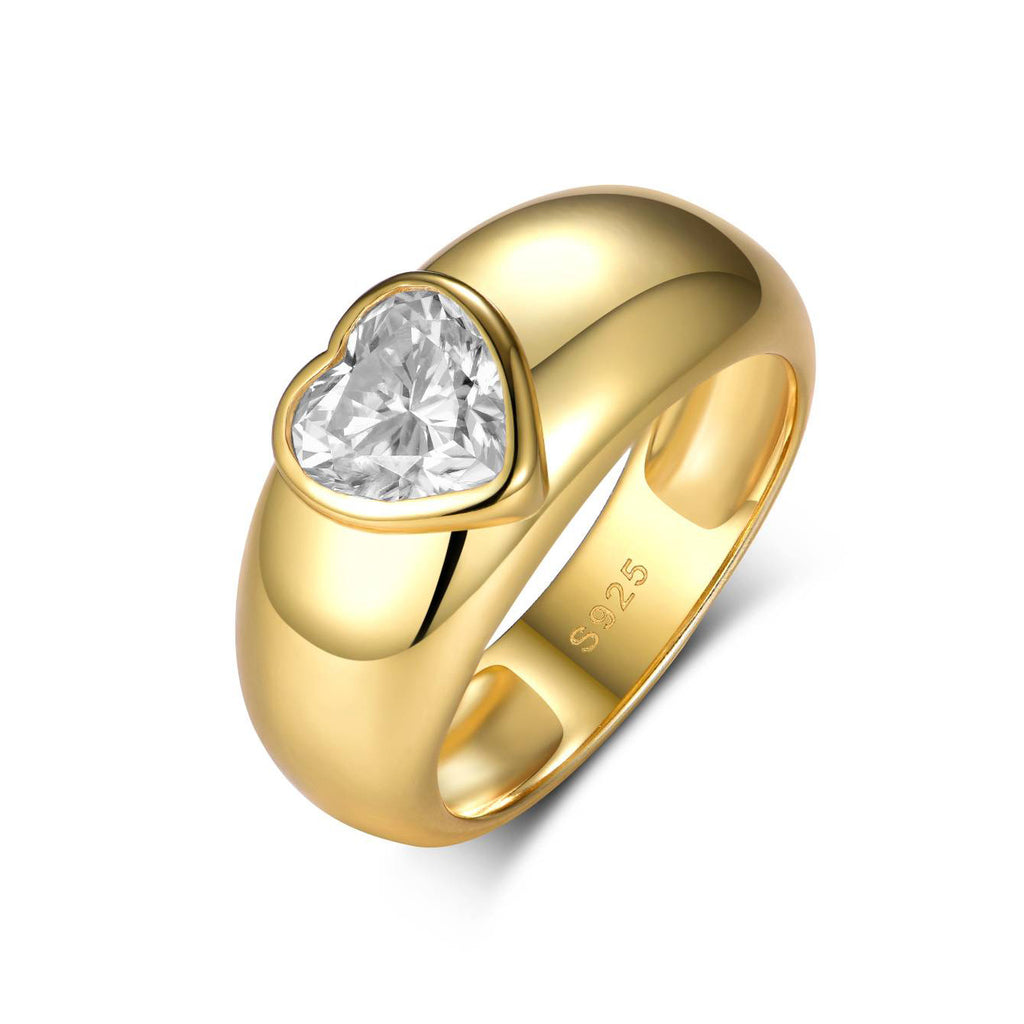 Gold ring with a heart-shaped diamond on a white background