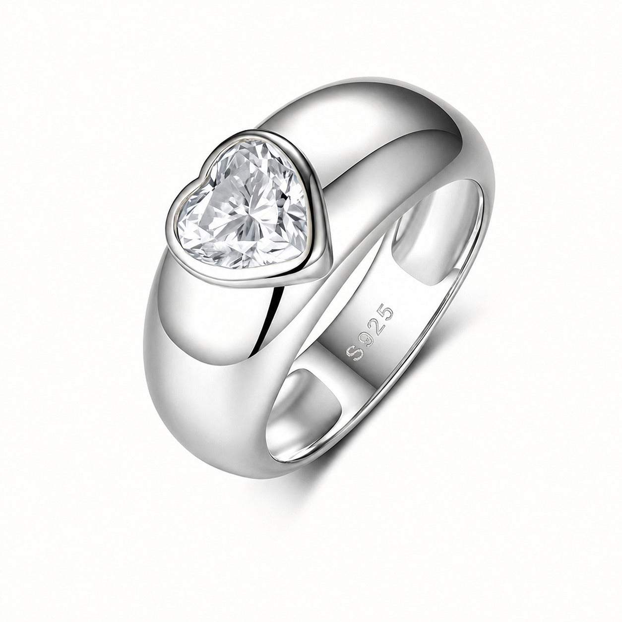A polished sterling silver ring featuring a heart-shaped clear gemstone in a bezel setting, with 'S925' stamped on the inner band, shown on a clean white background.