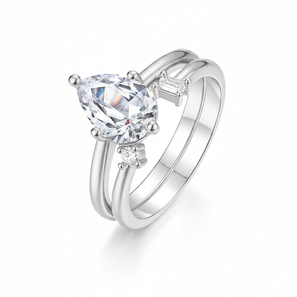 A silver-tone double-band ring with a large pear-cut clear gemstone and smaller accent stones, shown on a white background with the Linna Jewelry logo and a Chinese text label.